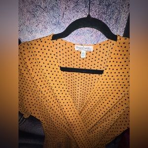 Brown jumpsuit with black dots.